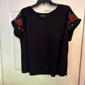 Black top with embroidered flowers